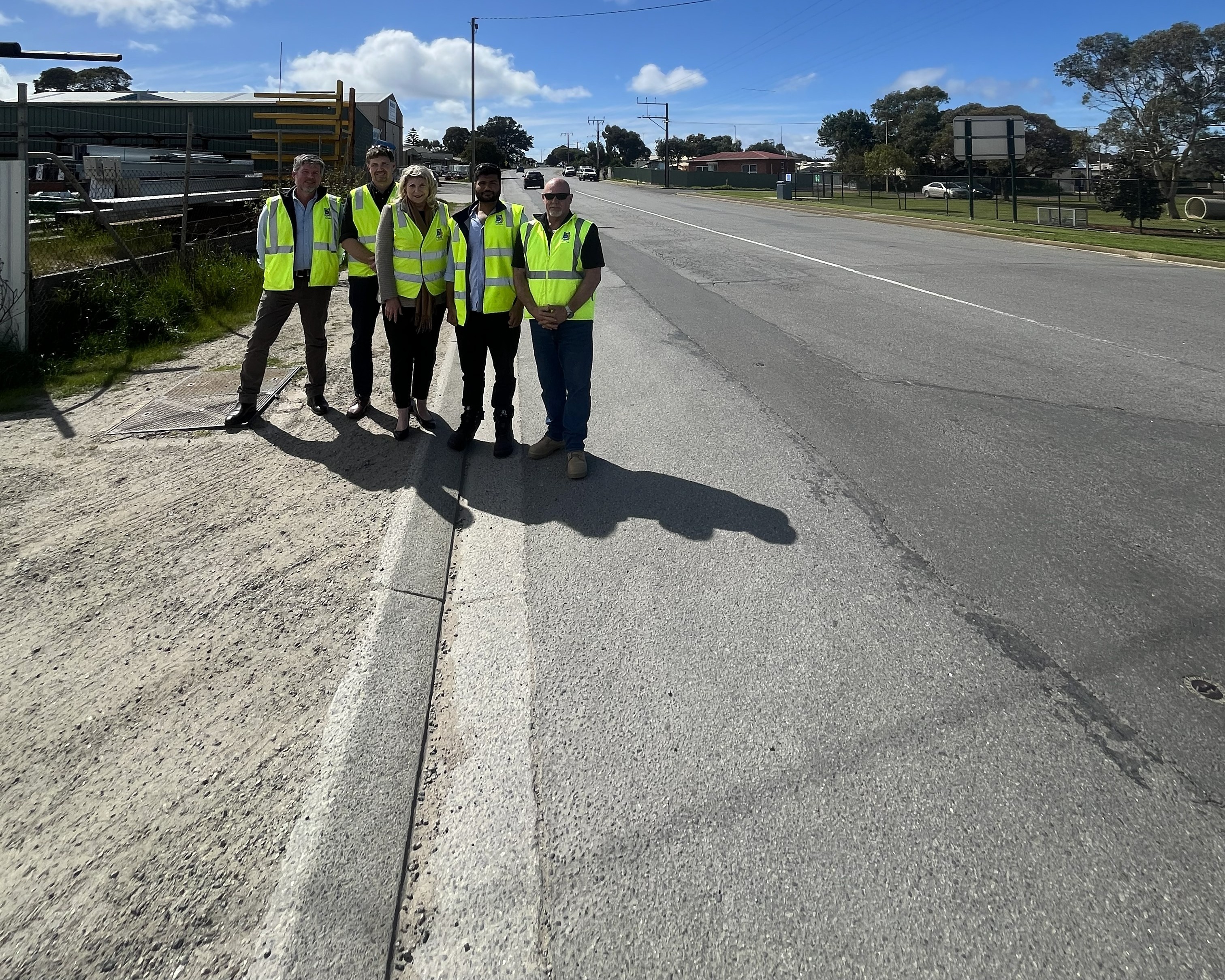 Council employees and Mayor Diana Mislov at Verran Terrace road