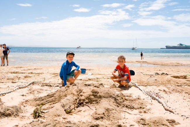Picture: children competing in the Tunarama sand sculpting competition